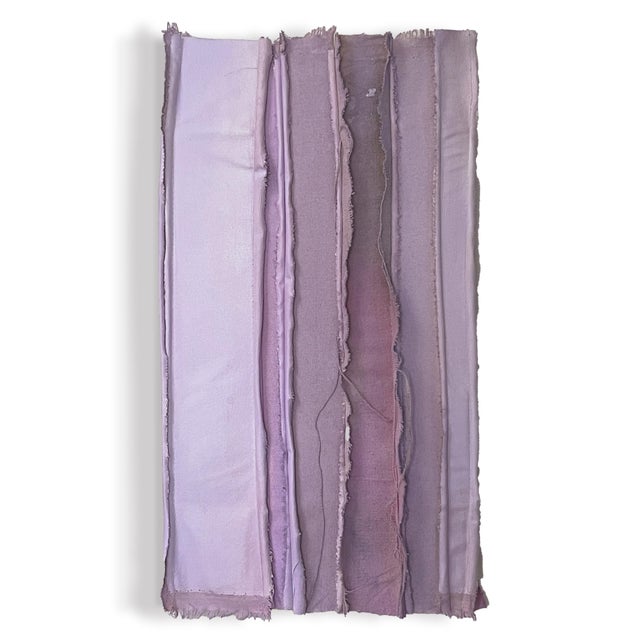 Surplus canvas and fabrics are sewn together and stretched over reused wood stretcher bars and then embellished with...