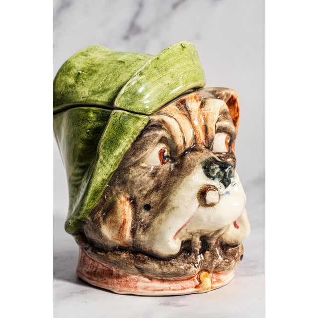 Delightfully expressive and full of character, this circa 1920s ceramic humidor captures the unmistakable charm of the...