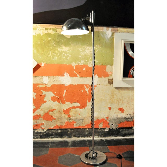 A chromed metal floor lamp. It was designed by Goffredo Reggiani and manufactured by Reggiani circa 1970. I have official...