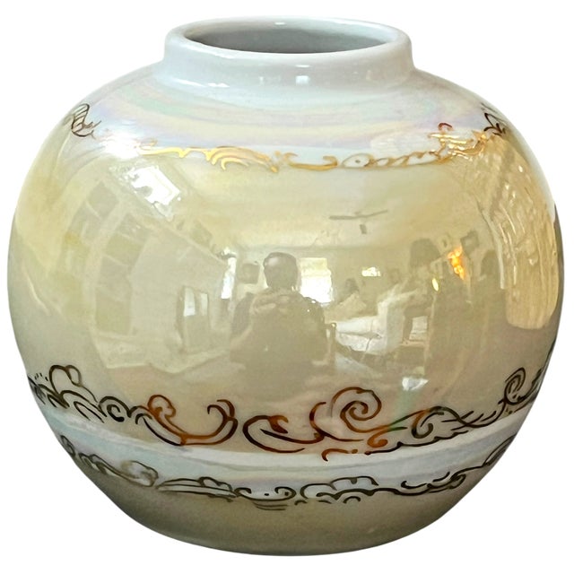 A beautifully executed vintage studio porcelain cabinet vase featuring a classic globe form finished in a luminous...