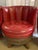 This set of 4 vintage 1970s whiskey barrel chairs are covered in red vinyl with a quilted style. They are finished with...