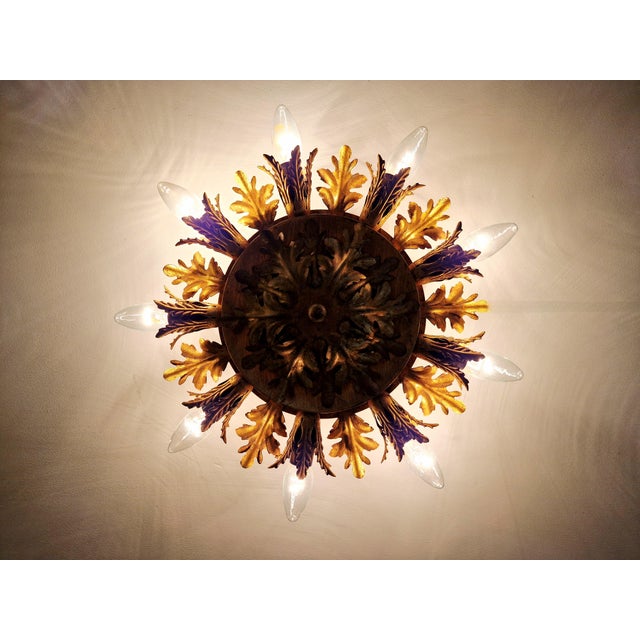 Gold-tone metal ceiling light with floral decoration, produced by the italian manufacturer banci firenze, 1970s....