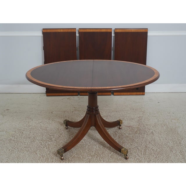 Age: Approx. 40 Years Old Details: Duncan Phyfe Pedestal Mahogany Brass Capped Feet & Casters High Quality Construction...