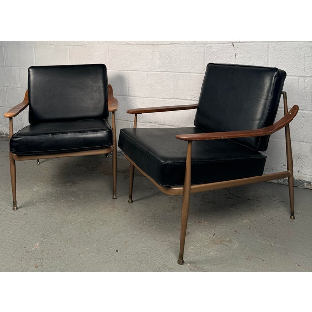 Make a bold design statement with these mid-century lounge chairs by Howell, where vintage elegance meets everyday...