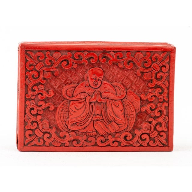 Chinese Cinnabar Buddha Decorative Box, relief carved. 1.5" H x 5" W x 3.5" D. Provenance: From a New York City...