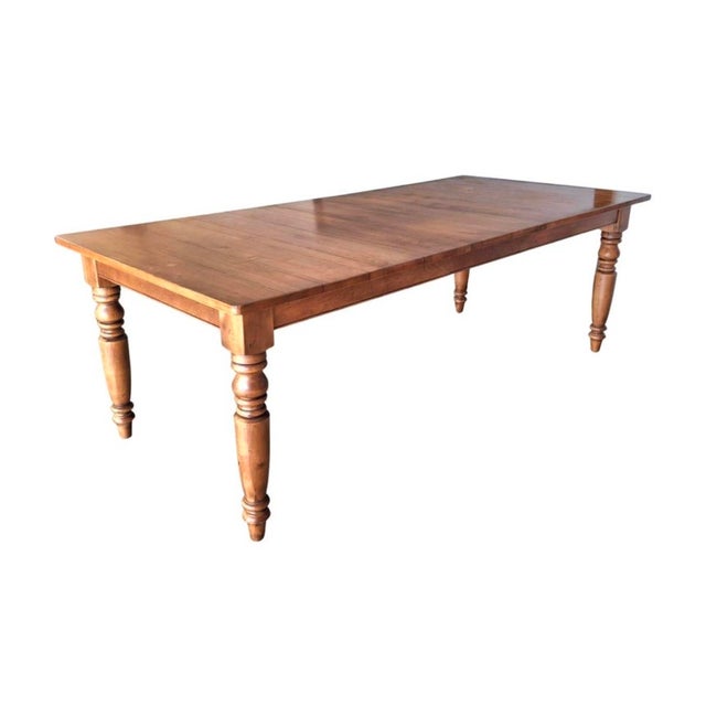 A gorgeous maple harvest country dining table with turned legs. USA, late 20th Century, possibly Ethan Allen Measures:...