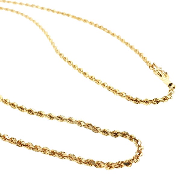 A late 20th-century 14k yellow gold 20" diamond-cut rope chain. The chain measures 2mm wide and weighs 7.5 grams.
