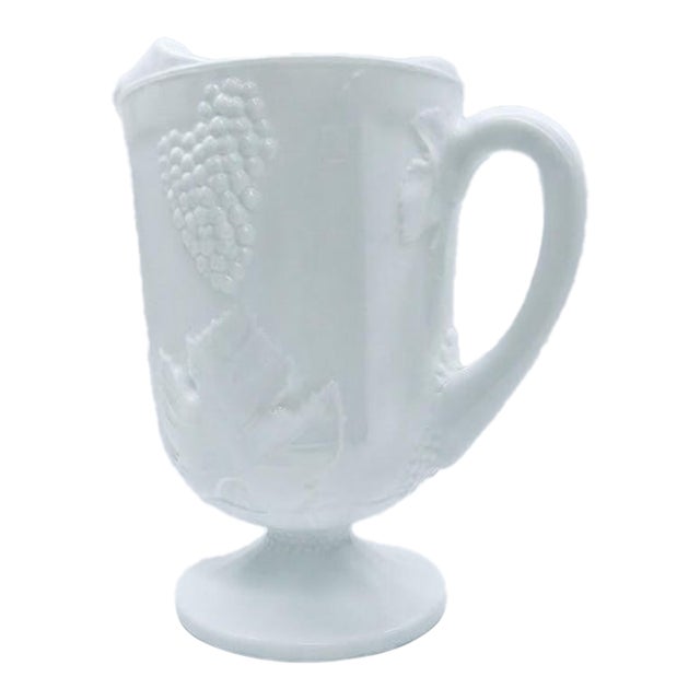 Vintage Milk Glass Footed Pitcher With Embossed Grape and Vine Pattern For Sale