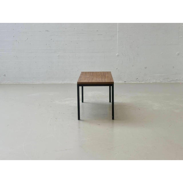 A simple vintage table with a clean, minimalist design from the second half of the 20th century. The rectangular tabletop...