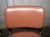 Mid Century Modern cantilevered chair with a tubular chrome plated steel frame and salmon colored vinyl upholstery....