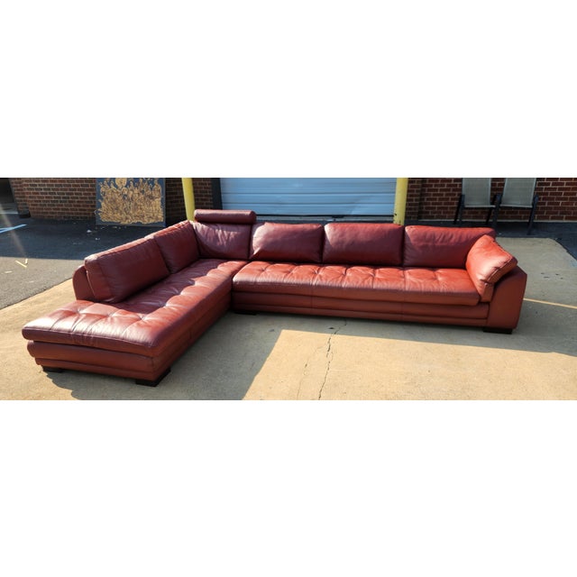 Large Roche Bobois leather sectional with generous proportions, deep seating, and a clean contemporary profile. A...