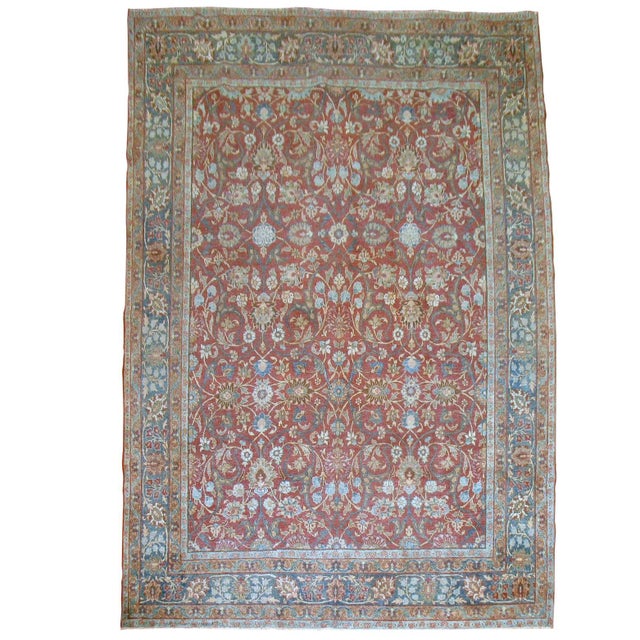 An authentic room-size handmade Persian Tabriz rug. Red field, various shades of blues and greens. 7'9'' x 11'4''