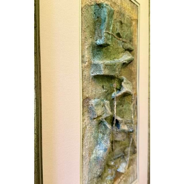 Mixed‑media relief by Argentine artist Nelly Arauz, created with layered plaster, gesso, and textured compounds on board....