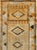 This mid-20th-century Turkish Anatolian runner presents a rhythmic sequence of geometric medallions arranged along a warm...
