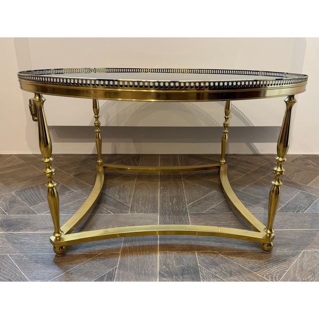 A wonderful example of a French Brass round Coffee Table that came from Paris. High quality throughout and mostly the...