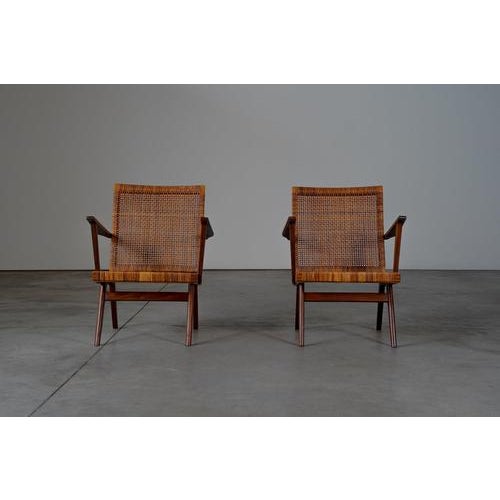 Rattan arm chairs The chairs are in a very good condition with traces of usage normal to their age. Some of the webbing...