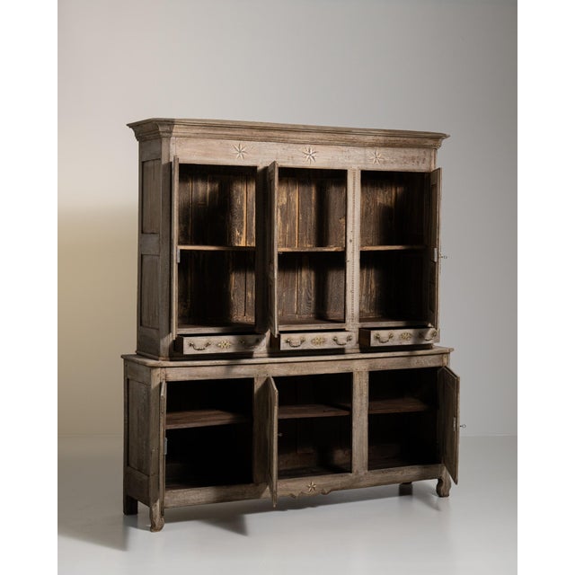 A brown wood, French Provincial-style cabinet from the 1820s, made in France. Crafted in wood, the piece retains its...