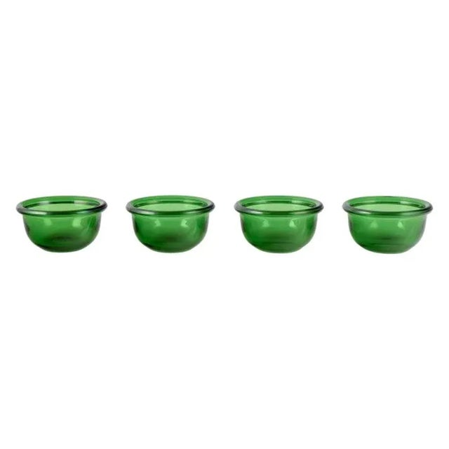 Kaj Franck for Nuutajärvi, Finnish glass artist. A set of four ‘Luna’ rinsing bowls in green art glass. Handmade. Circa...