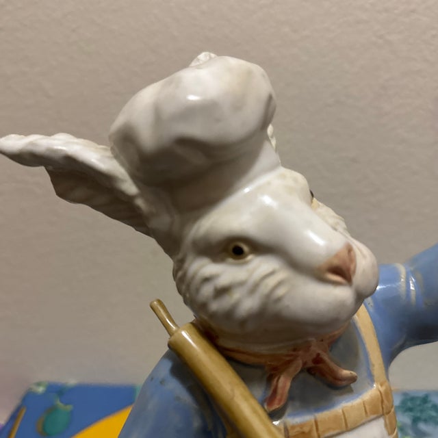 This standing figurine is crafted from durable ceramic and features a glossy finish with fine hand-painted details, from...