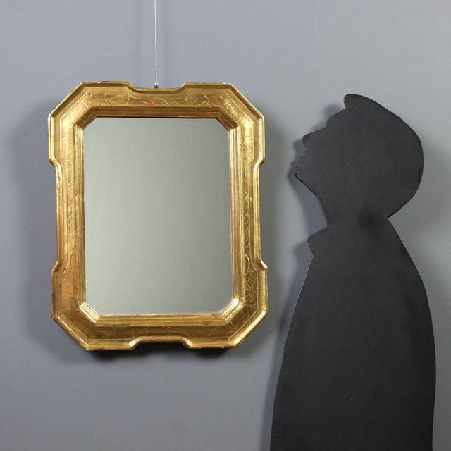 Giltwood Cabaret mirror dating back to the mid-19th century, crafted in Italy. The molded frame, richly decorated with...