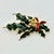 A lovely Christmas Brooch from the Mid 20th Century.. It features a dark green elongated holly leaf swag with gold berries...