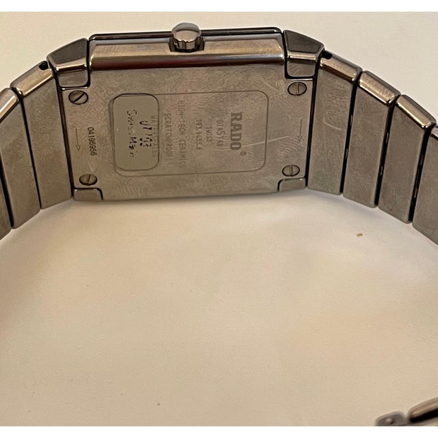 Model: Rado Sintra Display: Analog & Digital Department: Men Brand: Rado Watch Shape: Rectangle Case Size: 31mmx27mm Age...