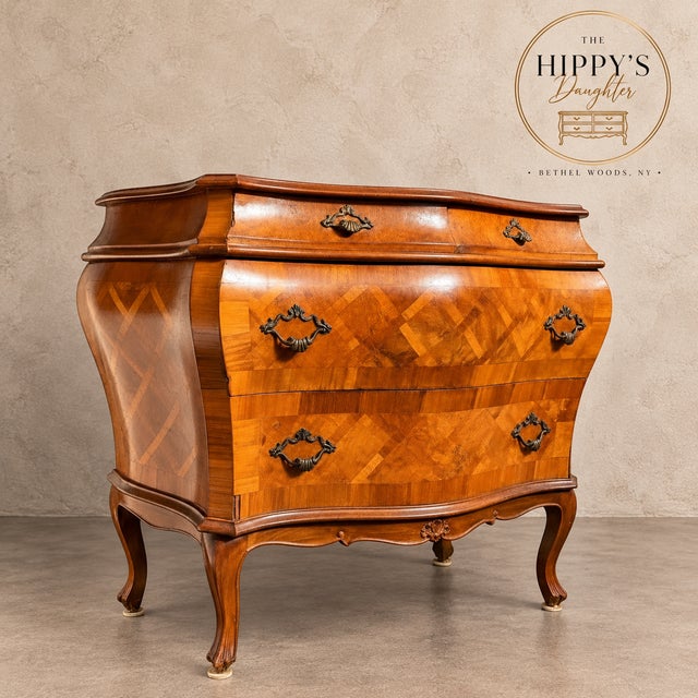 A true statement piece, this beautifully crafted Goldsmith bombe-style chest features a dramatic curved silhouette, richly...