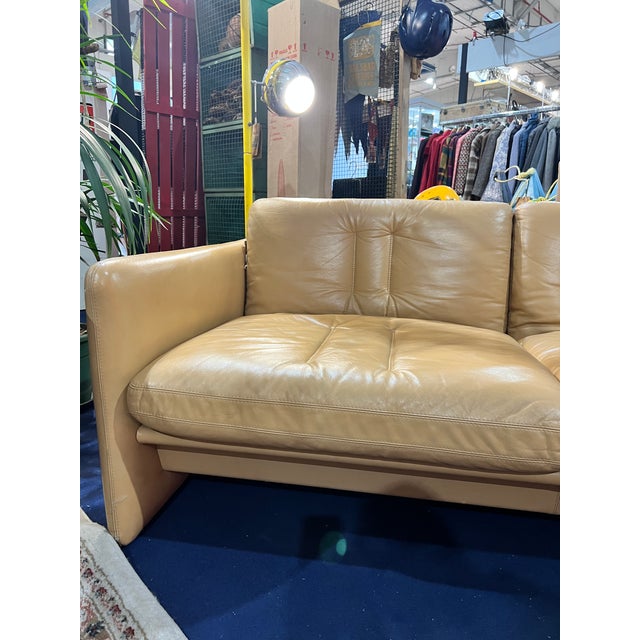 Two-seat sofa in beige leather, part of a two and three-seat pair, mid century style design, good condition, well...
