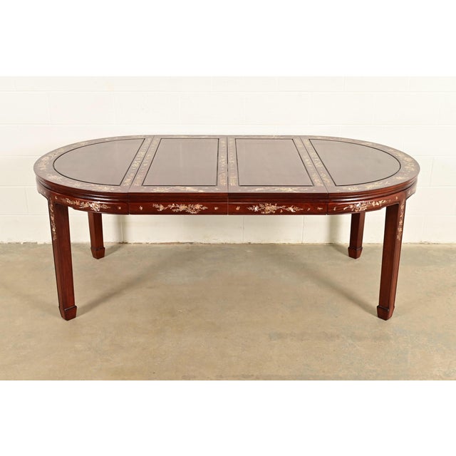 An outstanding antique Chinese extension dining table China, Circa 1890s Gorgeous carved rosewood, with exquisite Mother-...