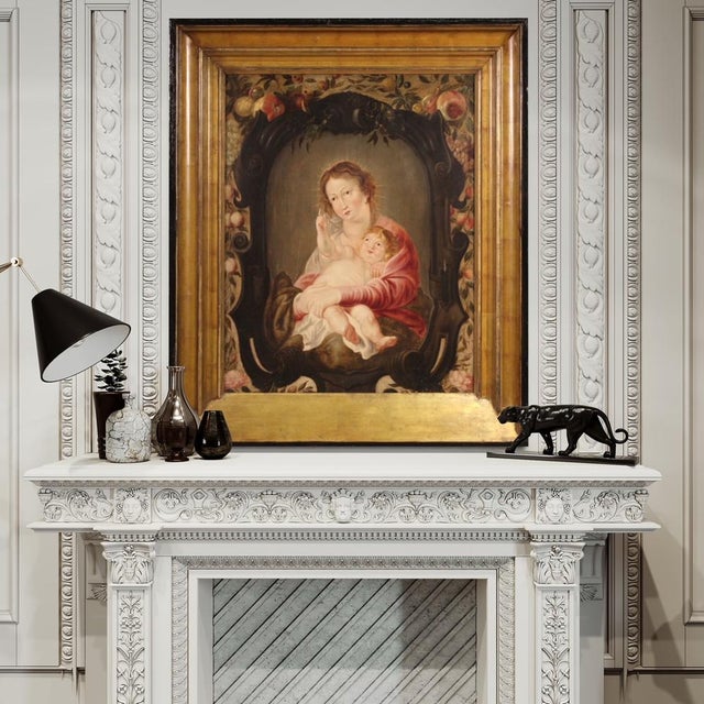 Antique Flemish panel from the first half of the 17th century. Oil painting depicting a splendid Madonna with child inside...