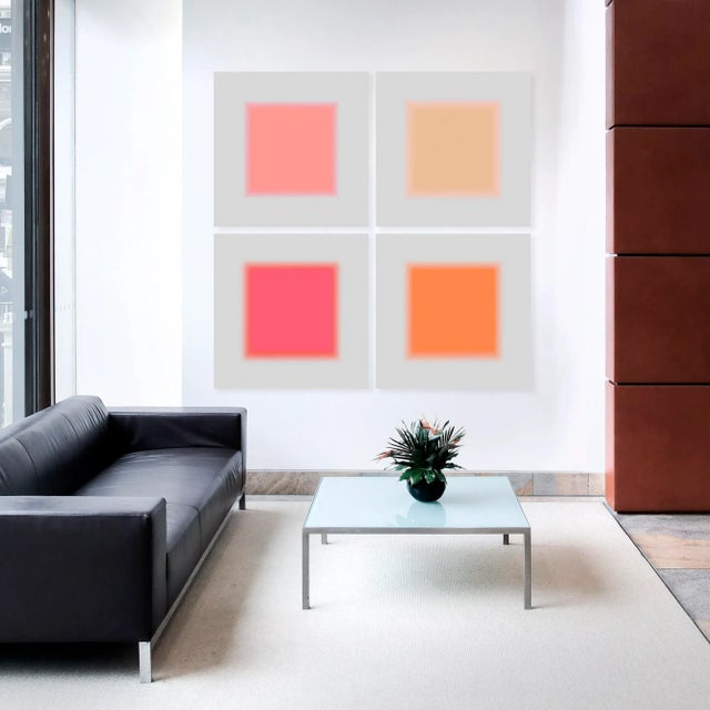 Minimalist contemporary art with square pink hues inside a grey background. This 4 piece artwork set has beautiful tones...