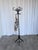 Vintage bentwood coat stand in the style of Thonet, featuring elegantly curved hooks and a sculptural black lacquered...