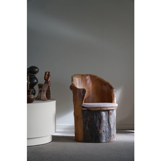 A highly decorative and sculptural stump chair made in solid pine. Hand carved by a swedish cabinetmaker in the 1970s....