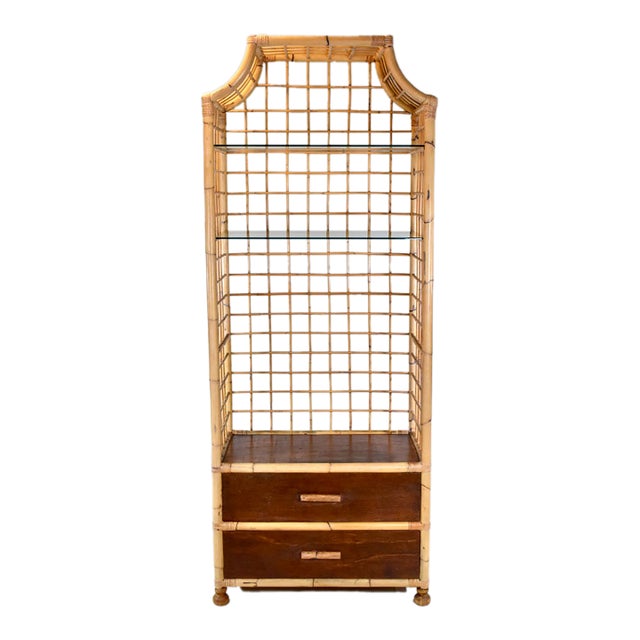 A Vintage Coastal Pagoda form bamboo Etagere Bookcase cabinet with two glass shelves and two generously size drawers for...
