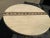Travertine round table top. Top has an inlaid Baltic brown strip . The top is is in excellent condition, no chips breaks ,...