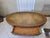 Offered is a classic mid-century oval coffee table from the prestigious "Heirloom Quality" collection by Weiman Furniture....