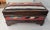 A skillfully Kilim Upholstered Stained Pine Middle Eastern Table Chest with nail head decorated trims. Measures 20.5" in...