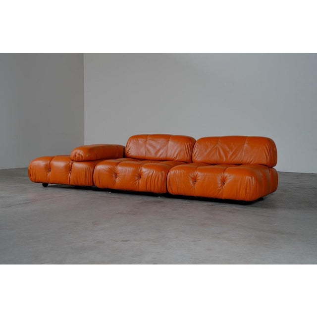 The sofa is in perfect condition. Reupholstered in orange leather. W 94 x d 94 x h 66 x 67 x sh 36 cm / per piece this...