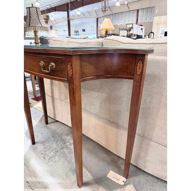 A beautifully crafted console table by Hammary, inspired by classic Federal design and distinguished by its graceful...