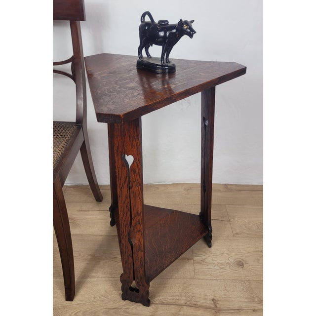 This is a wonderful Arts & Crafts English triangular occasional table that is sure to exude a beautiful country charm to...