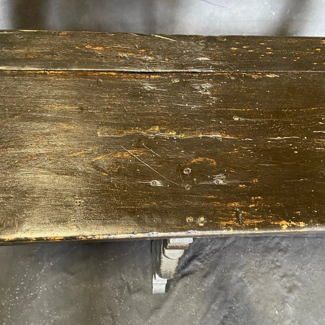 An exceptional pair of 19th century Spanish Baroque demilune tables or consoles in ebony painted walnut wood with...