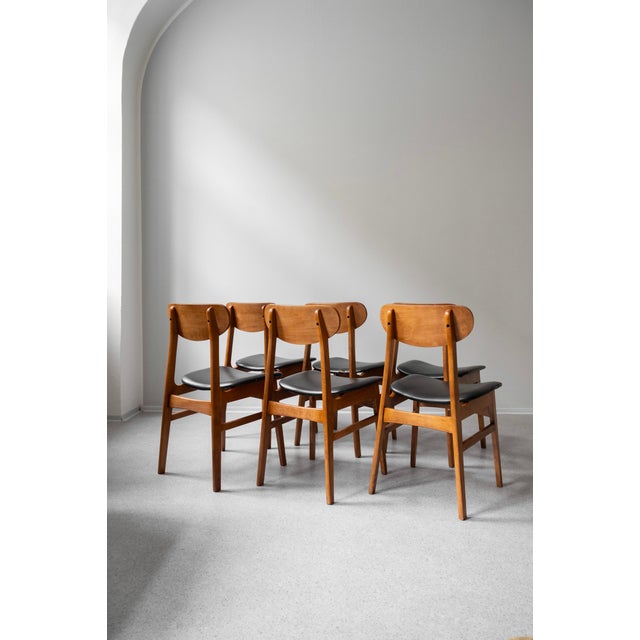A set of six chairs from Denmark from the 1960s. The teak wood has been renovated to a soft matte finish, the original eco...