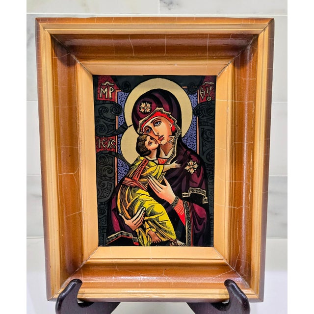 Bring a luminous piece of Ukrainian sacred art into your home with this original reverse glass painting “Virgin of...