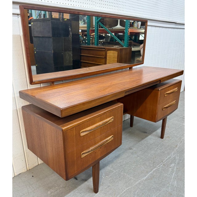 This listing is for a Mid-Century Danish Modern G-Plan Teak Vanity. Featuring a straight line design, rectangular top,...