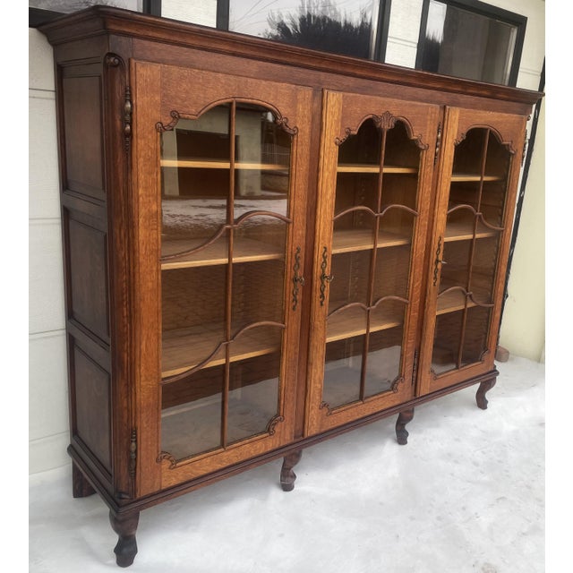 A sturdy 1950s bookcase, crafted entirely from solid oak. This piece of furniture features a classicist style, elegant...