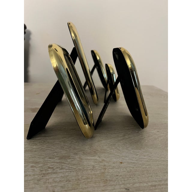 Elevate your tabletop styling or curated gallery shelves with this striking set of 5 vintage postmodern brass picture...