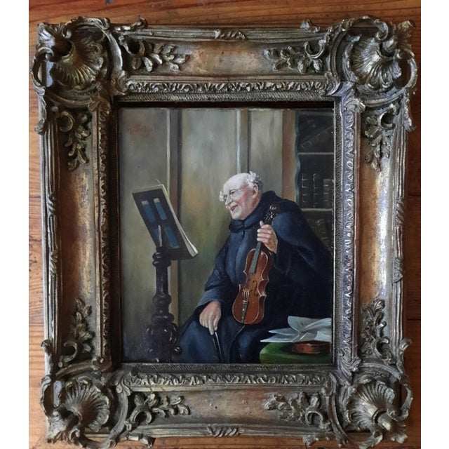 A charming and characterful antique German genre painting by Max Scholz (1855–1906), depicting a jovial monk seated with...