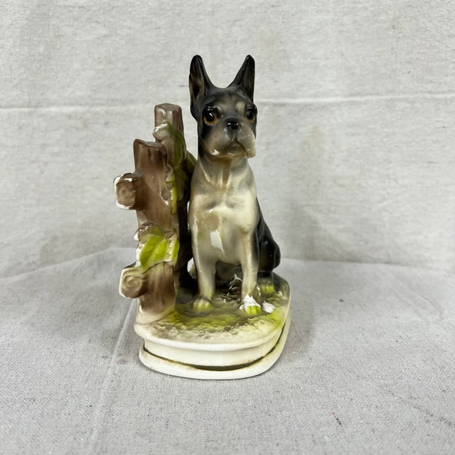 Mid Century boxer / bulldog figurine sitting in front of Fence. Marked Japan.