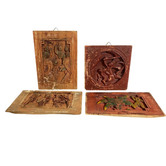 This set of four antique Chinese wall plaques features exquisite high-relief wood carvings depicting figures, warriors,...