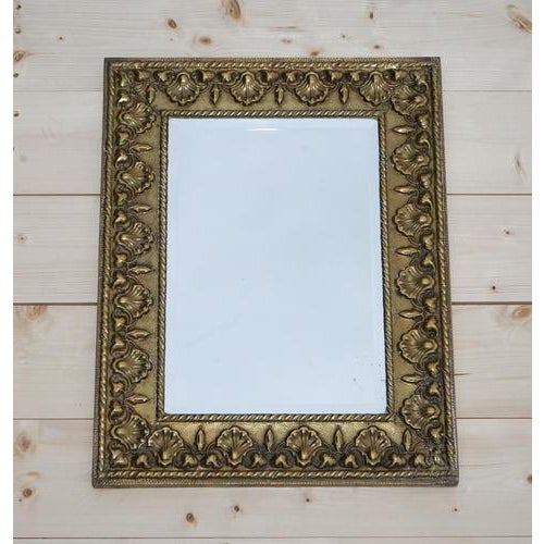 Antique Neoclassical Style Wall Mirror. A rectangular mirror with brass, showcasing shells and bleeding hearts. This...